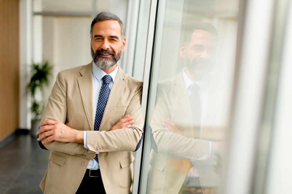 Man smiling looking at a camera 