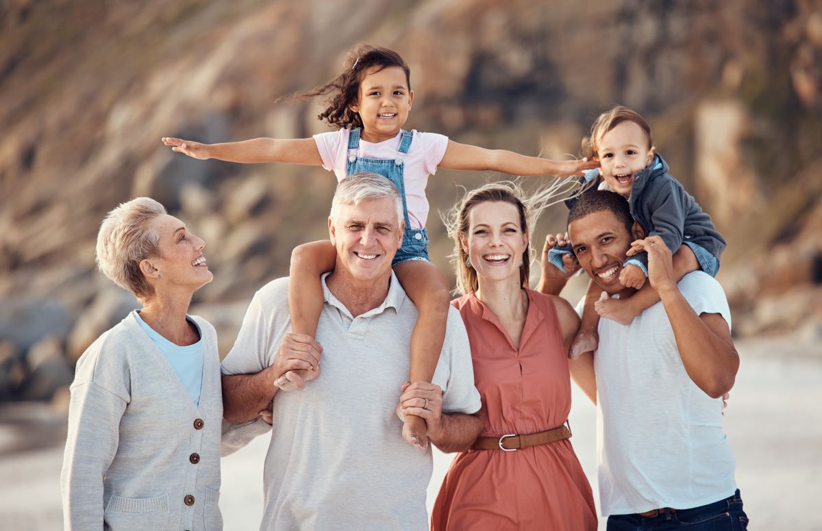 Intergenerational family smiling looking at a camera